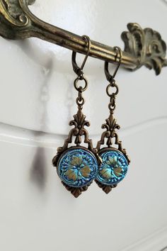 Vintage earrings made from buttons from the Czech Republic. Vintage buttons. Boho style. Art Deco style. Dangle and drop earrings. Gift for women. Blue color. Blue Vintage Jewelry With Charm, Vintage Blue Dangle Earrings, Vintage Blue Dangle Jewelry, Vintage Blue Handmade Jewelry, Vintage Handmade Blue Jewelry, Antique Round Wedding Earrings, Handmade Vintage Blue Jewelry, Vintage Blue Drop Earrings Jewelry, Blue Brass Jewelry For Wedding