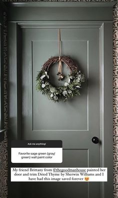 a door with a wreath hanging on it's side and an email message in the middle