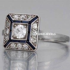 Vintage Art Deco Unique Ring/Blue Sapphire & Round Diamond Ring/Antique Square Shape Rustic Milgrain Ring/Woman's Wedding Engagement Ring 𝐂𝐞𝐧𝐭𝐞𝐫 𝐒𝐭𝐨𝐧𝐞 𝐃𝐞𝐭𝐚𝐢𝐥𝐬 ↣ Shape : Round ↣ Size : 5mm ↣ Color : White  ↣ Clarity : vvs ↣ Luster : excellent ↣ Make : high quality ✥ 𝐒𝐢𝐝𝐞 𝐒𝐭𝐨𝐧𝐞 𝐃𝐞𝐭𝐚𝐢𝐥𝐬 ↣ Shape : Round & Baguette ↣ Color : White - Blue Sapphire ↣ Clarity : vvs ↣ Luster : excellent ↣ Make : high quality ↣ Metal : rose gold - yellow gold -white gold - 925 silver ↣ Making Process : Handmade - crafted by our experienced team ↣ Metal Stamp : yes ✥ 𝐅𝐫𝐞𝐞 𝐄𝐧𝐠𝐫𝐚𝐯𝐢𝐧𝐠 The stones in jewelry are 100% hand-crafted it is cut and polished by our experienced craftsman. Provide you with the best service. -----ENGRAVING IS AVAILABLE ----- > name > birth date > enga Art Deco Wedding Jewelry With Halo Setting, Vintage White Rings With Halo Setting, Art Deco White Ring Jewelry, White Art Deco Ring Jewelry, White Art Deco Jewelry Ring, White Art Deco Ring, Art Deco Silver Halo Wedding Ring, Art Deco White Gold Jewelry For Marriage, White Art Deco Promise Ring