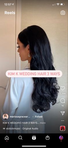 a woman with long black hair is looking at herself in the mirror and has an ad for kim k wedding hair 3 ways