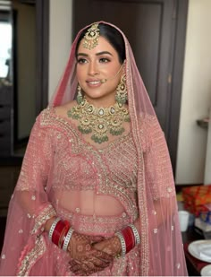 a woman in a pink bridal outfit