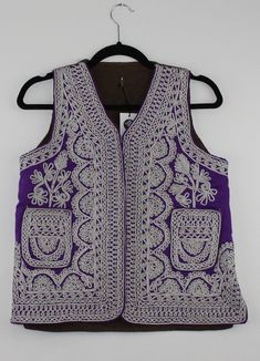 A rare find vintage sleeveless waistcoat from Afghanistan. Size: S/M Measurements (Flat): Bust: 18 Shoulder: 12 Height: 22 Note: Worn and minor signs of wear. Vintage Sleeveless Winter Vest, Sleeveless Winter Vest For Festivals, Vintage Embroidered Fitted Vest, Fitted Vintage Vest With Embroidery, Vintage Fitted Embroidered Vest, Traditional Summer Vest, Traditional Sleeveless Winter Vest, Traditional Sleeveless Summer Vest, Traditional Sleeveless Vest For Spring