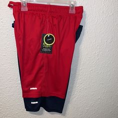 Driworks Athletic Shorts For Boys. For Your Little Athlete. Score A Two-Pack Of Performance Boys Shorts From Athletic Works Featuring A Comfortable Elastic Waist With Drawcord. Side Pockets Help Keep His Essentials Close While Moisture Wicking Technology Helps Keep Him Comfortable And Dry All Day Long, On And Off The Field. 1st Pair Red And 2nd Pair Blue And Shorts Size - L 10-12 Sporty Short Bottoms For School, Sporty Short School Bottoms, Team-colored Athletic Shorts For Gym, Sporty School Bottoms With Built-in Shorts, Casual Red Shorts For School, Red Casual Shorts For School, Red Activewear Shorts For Sports, Red Activewear For Sports Events, Sporty School Shorts