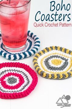 three crocheted coasters sitting next to a drink