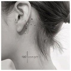 a woman's ear with the word always tattooed on her left side ribcage