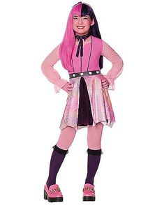 a girl dressed in pink and black is posing for the camera with her hands on her hips