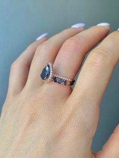 ✦Gorgeous London Blue Topaz Ring 2 Piece Set✦ ✧ Base Metal: 925 Sterling Silver ✧ Plating: 14K Rose Gold Vermeil ✧ Accented with Natural Crystals ✧ Average band width: 2.1 mm ✧ Center Stone: Topaz ✧ Color: London Blue ✧ Stone Cut: Pear ✧ Gem size: 8.0 x 6.0 mm ✧ Carat Weight: 1.21 ct. ✧ Gemstone creation: Natural ✧ Hardness: 8 (Mohs scale) ✧ Gemstone Origin: Switzerland ✧ Sizes 3.5-11.25 ✧ This ring set will arrive ready to gift in a Kherish Box. ✧ Due to the nature of the handmade process, each piece may slightly vary in color, size, shape, and contain natural inclusions. Every piece is gorgeous and one of a kind. *Please refer to photos for reference.  ✦ This Artist Has Autism✦ Every item you order from Kherish is handcrafted and packed by an artist with autism in RVA. Thanks to your sup Blue Topaz Engagement Ring, Topaz Engagement Ring, London Blue Topaz Ring, Topaz Color, November Birthstone, Put A Ring On It, Ring Promise, Anniversary Gift For Her, London Blue Topaz