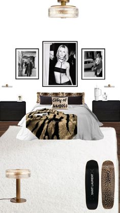 there is a bed with pictures on the wall above it and a skateboard next to it