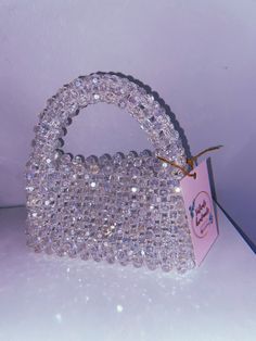 "100% handmade 🤍 Welcome to my store! Each bag is created with love and attention to detail, making them truly one-of-a-kind. Size: > width - 18 cm > height -  11 cm (20 cm with handle) The bags are strong enough to carry all your daily essentials, shiny enough to make your evenings sparkle, and with their unique designs, you can be sure to stand out from the crowd. Let's add a new one to your collection. 💞 Please feel free to contact me with any questions or special requests by pressing the \"Message seller\" button at the bottom of the page. Check out more of our unique designs:  https://www.etsy.com/shop/ValienteHandmadee" Trendy Evening Bag With Pearl Handle For Gift, Trendy Evening Bag With Pearl Handle As Gift, Trendy Beaded Evening Bag As Gift, Trendy Beaded Evening Bag Perfect As A Gift, Crystal Embellished Evening Bag For Gift, Trendy Handmade Evening Bag For Gift, Chic Beaded Clutch As A Gift, Handmade Handheld Evening Bag For Party, Silver Beaded Clutch For Gift