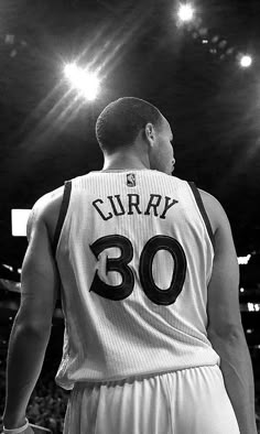 the back of a basketball player's jersey in black and white