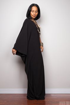 "Black one shoulder dress, Long black kaftan dress, Off shoulder evening dress, black cocktail dress, black party dress, reversible dress PRODUCT SIZE : Free Size * Chest : 40\" will stretch to 44\" * Waist : 40\" will stretch to 44\" * Hips : 40\" will stretch to 44\" * Sleeve length : 23\" * Length : 57\" - 58\" from shoulder to hem (measured when laying flat) MATERIAL : * ITY (polyester jersey) > soft and comfortable to wear, not as slippery as spandex. NOTE : * Model chest : 32\", waist : Chic Black One Shoulder Dress With Side Slits, Elegant Evening Maxi Dress With Batwing Sleeves, Evening Maxi Dress With Batwing Sleeves, Black Bohemian Maxi Dress For Evening, One Shoulder Black Dress With Side Slits, Black Bohemian Evening Maxi Dress, Black Bohemian Kaftan For Party, Black One Shoulder Maxi Dress For Summer, Chic Black Evening Kaftan