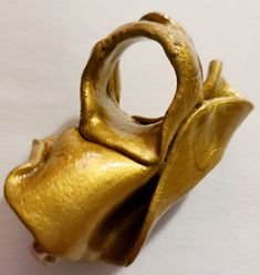 This gorgeous gold metallic hand-sculpted statement ring has a sculpted band and will best fit a woman, sized 7. It measures 2.75" x 1.5" and features two high-luster freshwater pearls. After painting it, I sealed it with a high-gloss glaze. It is very lightweight and extremely comfortable to wear. You won't even know you have this on. A versatile piece that will seamlessly blend with any of your other gold jewelry. From Kat Kouture! Rocker Chic Accessories, Statement Bib Necklace, Unique Pendant Necklace, Chest Piece, Mermaid Necklace, Vintage Vanity, Black Feathers, Statement Pendant, High Gloss