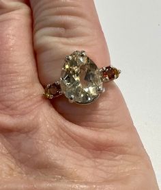 Center stone: genuine natural pear cut bytownite Size of stone: 11mm x 9mm Weight: approx 2.75cts Accent stones: 2 genuine natural round cut red zircons Size: 3mm Weight: approx .35ctw 2 genuine natural round cut citrines Size: 3mm Weight: approx .34ctw Metal: .925 stamped Sterling Silver Size: 7 Ring weigth: 2.9g Price: $129.99 Pear-shaped Topaz Jewelry With Accent Stones, Pear-shaped Topaz Gemstone Jewelry, Teardrop Topaz Ring With Accent Stones For Anniversary, Pear-shaped Topaz Jewelry For Anniversary, Classic Pear-shaped Gemstones For Anniversary, Pear-shaped Topaz Anniversary Ring, Classic Faceted Gemstones For Anniversary, Pear Shaped Multi-stone Ring As Gift, Pear-shaped Multi-stone Ring For Gift