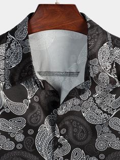 The Graphic Print Collared Short Sleeve Shirt is an expressive piece that brings a burst of personality to your summer outfits. The collared neckline adds a touch of sophistication to the shirt, creating a blend of casual and refined aesthetics. Features: 97% Polyester, 3% Spandex Premium fabric with slight stretch Regular fit Wrinkle-free fabric with no shrinkage after washes Colorfast, Wearable material Machine wash cold; Tumble dry low; No bleach Button-front shirt featuring a spread collar and short sleeve. Great for leisure, work, dating, dinner, costume parties, themed parties, sun beach, vacation, BBQ, Hip Hop, and daily life. Size Chart: Summer Printed Collared Tops, Summer Collared Printed Tops, Summer Tops With Relaxed Fit And Casual Collar, Black Casual Collar Top For Vacation, Trendy Printed Short Sleeve Shirt For Spring, Graphic Print Patterned Blouse For Summer, Summer Graphic Print Patterned Blouse, Patterned Graphic Print Blouse For Summer, Summer Printed Shirt With Casual Collar