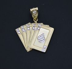 four gold playing cards with diamonds on them