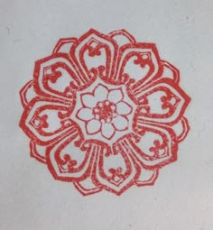 a red and white drawing of a flower