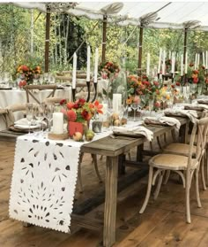 an outdoor dining area with tables and chairs set up for a meal in the sun