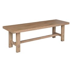 a large wooden table sitting on top of a white floor