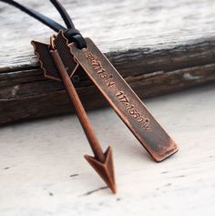 an arrow necklace with the words, we wish upon it