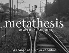 a black and white photo of train tracks with the words metatheism on it