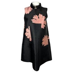 Alexander McQueen Mini Dress Black and Pink, Size Small - Floral print - Mini length - Sleeveless - Mandarin collar - Hidden rear zip closure - Missing tags Item details: A floral black mini A-line dress by Alexander McQueen. ​The contrast color palette reflects a complex McQueen’s character. ​It’s an edgy dress with a strong fashion statement. A mandarin collar and unusual cut along with an inserted panel in the front clearly deliver a message of confidence. These two details provides a great m Black Silk Sleeveless Mini Dress, Black Sleeveless Silk Mini Dress, Black Sleeveless Dress With Floral Print For Evening, Black Sleeveless Floral Print Evening Dress, Chic Black Sleeveless Silk Dress, Black Silk Knee-length Mini Dress, Black Silk Mini Dress For Spring, Black Silk Dress With Floral Print, Black Silk Floral Print Dress