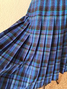 Vintage 70s Pendleton wool pleated skirt in shades of blue and black plaid. Zipper up the side and button waist. It is not lined. Composition - 100% virgin wool, made in USA. Marked size UK10 fits like a 8 US. Excellent vintage condition. Flat measurements: waist - 35 cm/ 13.8'' /there is lightly stretch/ length - 74 cm/29.1'' Blue Full Skirt With Accordion Pleats, Fitted Blue Skirt With Pleated Hem, Retro Blue Pleated Skirt, Blue Lined Pleated Skirt For Fall, Vintage Blue Pleated Skirt, Vintage Blue Pleated Skirt Bottoms, Blue Fitted Pleated Skirt For Fall, Fitted Blue Pleated Skirt For Fall, Vintage Blue Pleated Bottoms