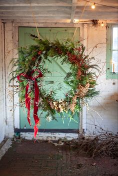 A giant  Christmas wreath made with fresh foliage and dried flowers.  Displayed in my flower studio in Kent, UK Big Christmas Wreath, Alternative Christmas Wreath, Foraged Wreath Christmas, Giant Wreath Christmas, Large Wreath Outdoor, Foraged Christmas Wreath, Foraged Wreath, Giant Christmas Wreath, Giant Wreath