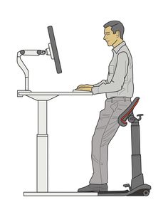 a man sitting at a computer desk with a keyboard and monitor on top of it