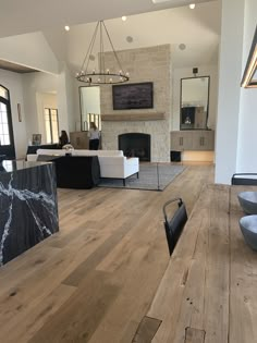 a living room filled with furniture and a fire place in the middle of a room