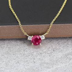 "14k Lab Created Ruby Diamond Necklace | Real Gold Minimalist Ruby Necklace | 5.0MM Simulated Ruby Pendant | July Birthstone Necklace | Everyday Jewelry P R O D U C T 𝄪 D E T A I L S ✽ July Birthstone. Passion. Beauty. History. ✽ Metal: 14k Yellow Gold, White Gold & Rose Gold ✽ Chain Length: 14\" - 20\" (Classic Rolo Chain) ✽ Center Stone: 5.0 mm Lab Created Ruby (approx. 0.5ct) ✽ Diamond Size: 2.0 mm x 2pcs (total 0.06ct) ✽ Diamond Color: G ✽ Diamond Clarity: VS-SI1 ✽ Made to Order O T H E R ? Ruby And Diamond Pendant, Yellow Gold Ruby Necklace With Prong Setting, 14k Gold Necklace With Gemstone Accents For Anniversary, 14k Gold Necklaces With Gemstone Accents For Anniversary, Yellow Gold Ruby Necklaces With Gemstone Accents, Cotton Dress Indian, Ruby Diamond Pendant, Ruby Diamond Necklace, Antlers Decor