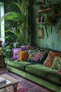 a living room filled with green couches and lots of potted plants on the wall