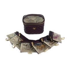 The rich and decadent Chocolate Getaway Jewelry Case is the perfect accessory for any jewelry lover! With 6 removable clear front pouches, storing earrings, rings, bracelets and more has never been more convenient. It is the perfect travel case for keeping small to medium jewelry from getting lost or tangled at home or on-the-go. Features: 6 Removable Clear Front Pouches Easy to Clean wipeable Interior Clear View Top 1 Padded Ring Strap Size Information: 5.5" L x 4" W x 3.5” H Material: Brown - Travel Jewelry Storage Rectangular Case, Elegant Jewelry Storage For Travel, Luxury Rectangular Jewelry Storage Case For Travel, Luxury Rectangular Jewelry Storage For Travel, Luxury Rectangular Travel Jewelry Storage Case, Portable Gold Jewelry Storage For Travel, Elegant Compact Jewelry Storage For Everyday Use, Brown Rectangular Jewelry Storage As Gift, Elegant Portable Rectangular Jewelry Case