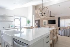 a large kitchen with an island in the middle and lots of counter space around it