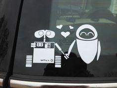 a sticker on the back of a car with an image of a robot holding a heart