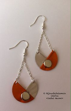 the earrings are made from wood and metal