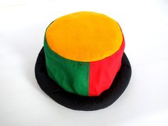 This Rasta Jamaican Bucket hat is perfect for Summer Reggae Festivals. This solid Bucket hat features a Jamaican Rasta Inspired Striped Band atop a solid , Red green yellow Rasta color bucket hat. Rock this hat as you dance the night away at your next outdoor concert or event. Fashionable and a must-have . This Hat is unisex that looks great on both men and women . This Hat is very durable and can be used as a special gift . -Solid Unisex Jamaican Adult Sun Hat -Rasta Reggae Inspired Striped Ban Adjustable Multicolor Cap Sun Hat, Adjustable Multicolor Cap-shaped Sun Hat, Multicolor Short Brim Mini Hat, Multicolor Short Brim Hat, Adjustable Multicolor Bucket Hat, Adjustable Multicolor Wide Brim Costume Hats, Adjustable Multicolor Wide Brim Mini Hats, Adjustable Multicolor Brimmed Costume Hats And Headpieces, Adjustable Multicolor Bucket Mini Hat