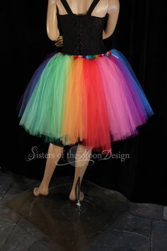 "Perfect tutu for Pride! This tulle tutu skirt Can also be used for carnivals, weddings, costumes, clowns, or anything rainbow themed! This tutu design is extra fluffy! This rainbow tutu design is Handmade from 50yards, two layers of gathered panels of soft smooth red, orange, yellow, mint, green, turquoise, purple, fuchsia and hot pink Bridal tulle. All tulle panels have been tightly machine gathered and serged to the soft rainbow fabric covered elastic waistband. This tutu is fully sewn not ti Spring Costume Party Fitted Tutu Dress, Fitted Tutu Dress For Spring Costume Party, Spring Costume Party Tutu Dress With Tulle Skirt, Multicolor Tulle Tutu Dress For Costume Party, Fun Fitted Tutu Dress For Party, Fitted Multicolor Tutu Dress For Fun, Spring Costume Tulle Tutu Dress, Fun Fitted Multicolor Tutu Dress, Spring Tulle Tutu Dress For Costume