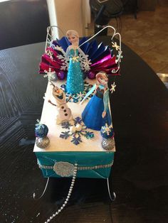 a frozen princess birthday cake on a table