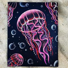 a painting of a jellyfish on a black background with bubbles and water droplets around it