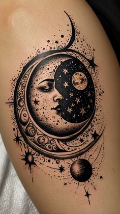 a woman's thigh with a crescent moon and stars on it