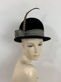 "\"It's not the shape of a woman's face that really decides, but the attitude of the hat\" Frank Olive And this hat has some attitude! Black velvet bowler style with a wool black and white houndstooth ribbon band, that end at the right side with a two loops and a long pheasant feather. inside is a smooth wool felt with a pink grosgrain band. Label: Frank Olive Bloomingdales New York Stamped: Cotillion Imported Made in France 20\" circumference around inner grosgrain band 6\" high with an 1.5\" b Vintage Top Hat With Short Brim For Fall, Vintage Short Brim Top Hat For Fall, Vintage Wool Cloche Hat With Short Brim, Vintage Cloche Hat With Curved Brim For Fall, Vintage Cloche Hat For Fall, Vintage Wide Brim Mini Hat For Fall, Vintage Top Hat For Fall Party, Vintage Wool Top Hat With Short Brim, Vintage Wool Brimmed Top Hat