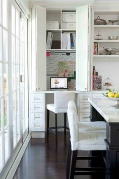 the kitchen is clean and ready to be used as a dining room or office space