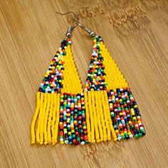 These African Maasai Zulu Style inspired Tribal earrings are definitely a standout. If you love African jewelry styles and these statement earrings, these are your earrings. Maasai, Zulu, African Jewelry, Fringe Earrings, Earring Patterns, Jewelry Care, Statement Earrings, Design Details, Color Variations