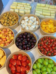 bowls filled with different types of fruits and vegetables