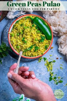 a person holding a spoon over a bowl of green peas pulao