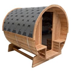 a wooden barrel sauna with benches on the side