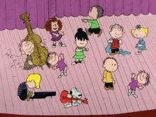 peanuts dancing on the stage in charlie brown's big band show, with other cartoon characters