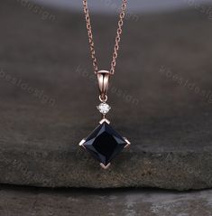 Here we have a princess cut black onyxnecklace in rose gold. For those who are looking for black gemstone jewelry which is handcrafted in details, this unique onyx necklace would be a perfect choice for you. Whether it be a Birthday gift for her, an anniversary gift her, or a celebration of yourself. Details: *8mm princess cut natural black onyx *Stone weight: 3CT *Side stone: Moissanite Chain: 18 Inches length. I accept custom making order. Please contact me if you need this service. All the je Moissanite Chain, Anniversary Necklace, Black Onyx Necklace, Onyx Jewelry, Pendant For Women, Onyx Necklace, Pretty Necklaces, Personalized Anniversary