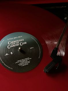 a red record sitting on top of a table