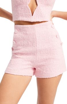 Oversized covered buttons trim the sides of these textured high-waist shorts. 2 1/2" inseam; 25" leg opening; 12" front rise; 16 1/2" back rise Hidden back-zip closure Lined 100% polyester Hand wash, line dry Imported Chic High-waisted Button Closure Shorts, Chic Fitted Shorts With Button Closure, Chic High-waisted Shorts With Button Closure, Spring Shorts With Button Closure And Short Inseam, High Waist Shorts With Button Closure For Spring, Chic Pants With Button Closure, Chic High Rise Shorts With Button Closure, Chic Short Length Pants With Button Closure, Fitted High-waisted Shorts With Button Closure